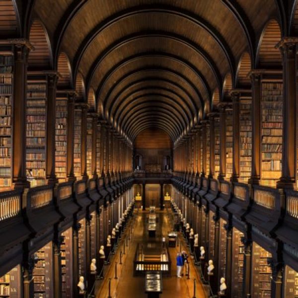 Couple visiting the Long Room at Trinity College, Dublin